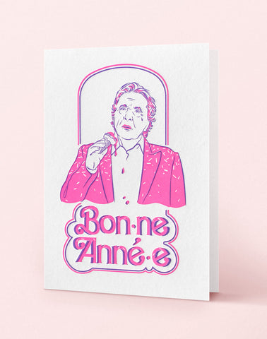 Carte voeux imprimée en letterpress deux couleurs rose fluo et violet, créee par Cécile Alvarez représentant Michel Sardou sur le theme de l'écriture inclusive.